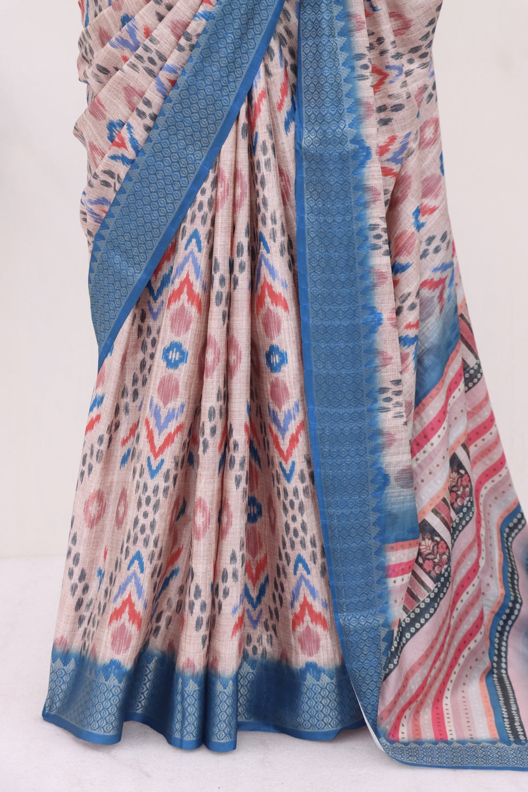 Skin and Blue Printed Silk Saree