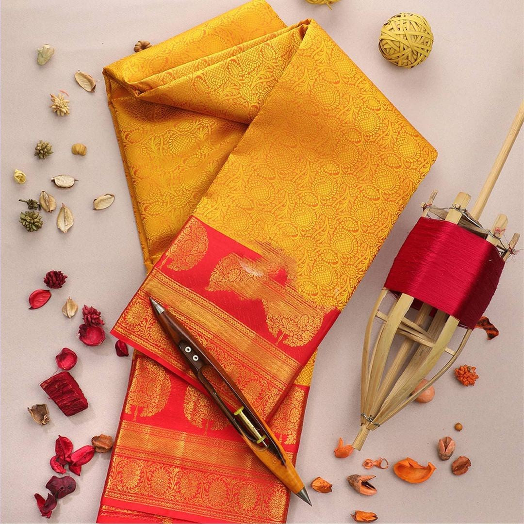 Adorning Yellow Soft Banarasi Silk Saree With Flattering Blouse Piece