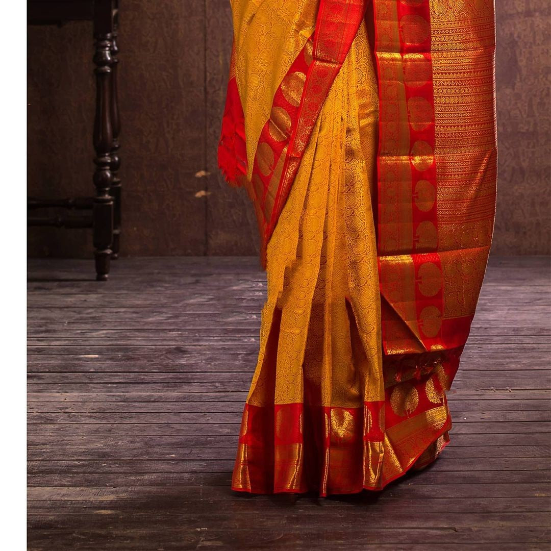 Adorning Yellow Soft Banarasi Silk Saree With Flattering Blouse Piece